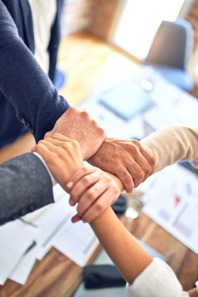 Team joining hands - contact Localanto for local SEO help