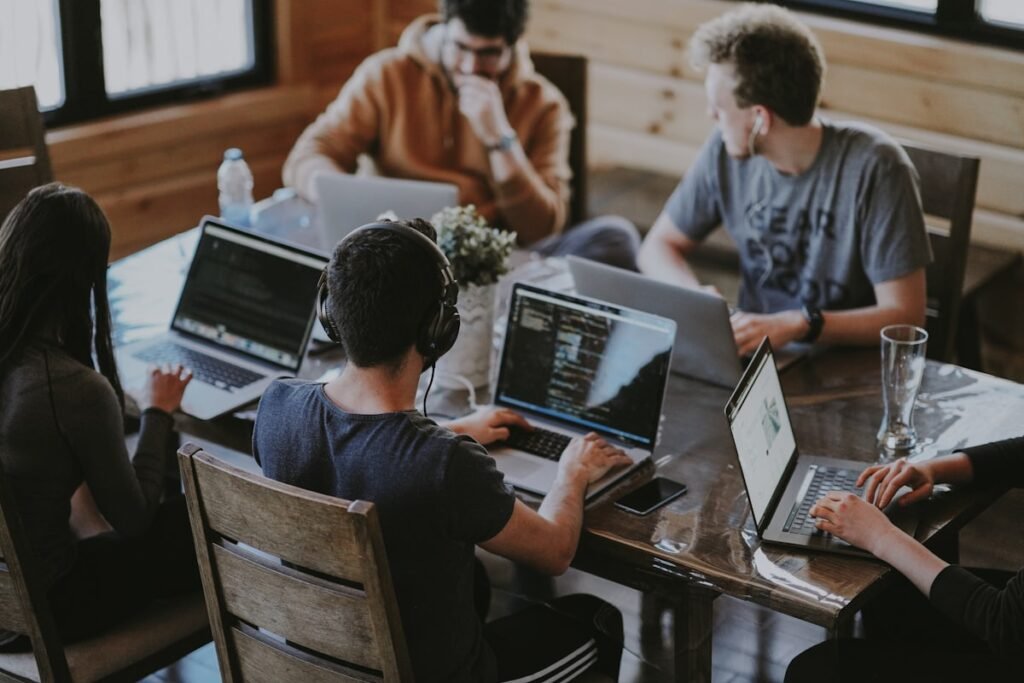 The Localanto local marketing team collaborating on laptops